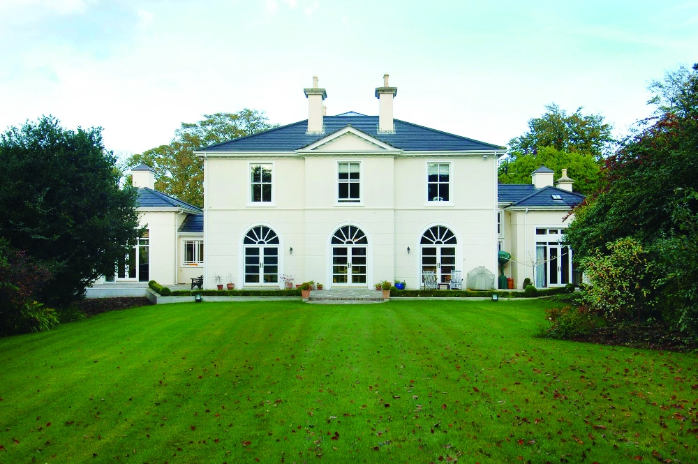 Symmetrical home with central pyramid rooflight